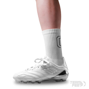 make a white sock with a big black G on the back of sock and have grip underneath it - Mid