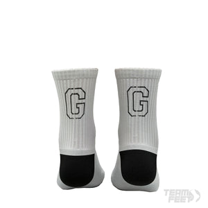 make a white sock with a big black G on the back of sock and have grip underneath it - Mid