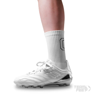 make a white sock with a big black G on the back of sock and have grip underneath it - Mid
